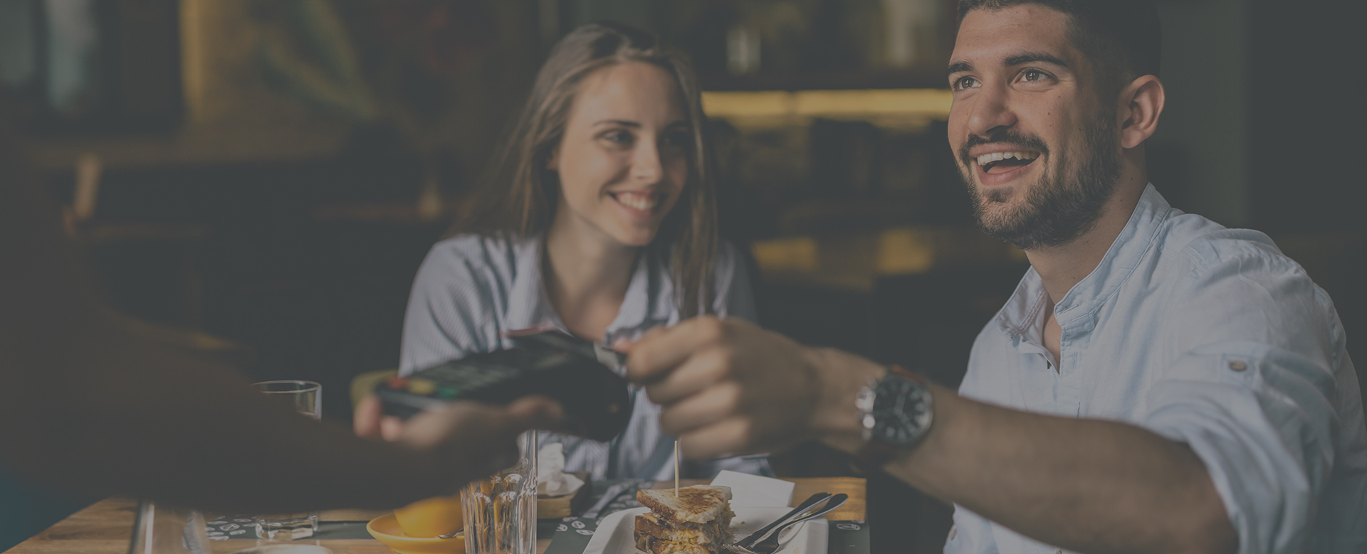 two people enjoying a meal at a restaurant