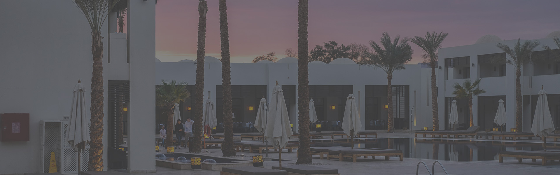 A pool-side outdoor dining area at a hotel