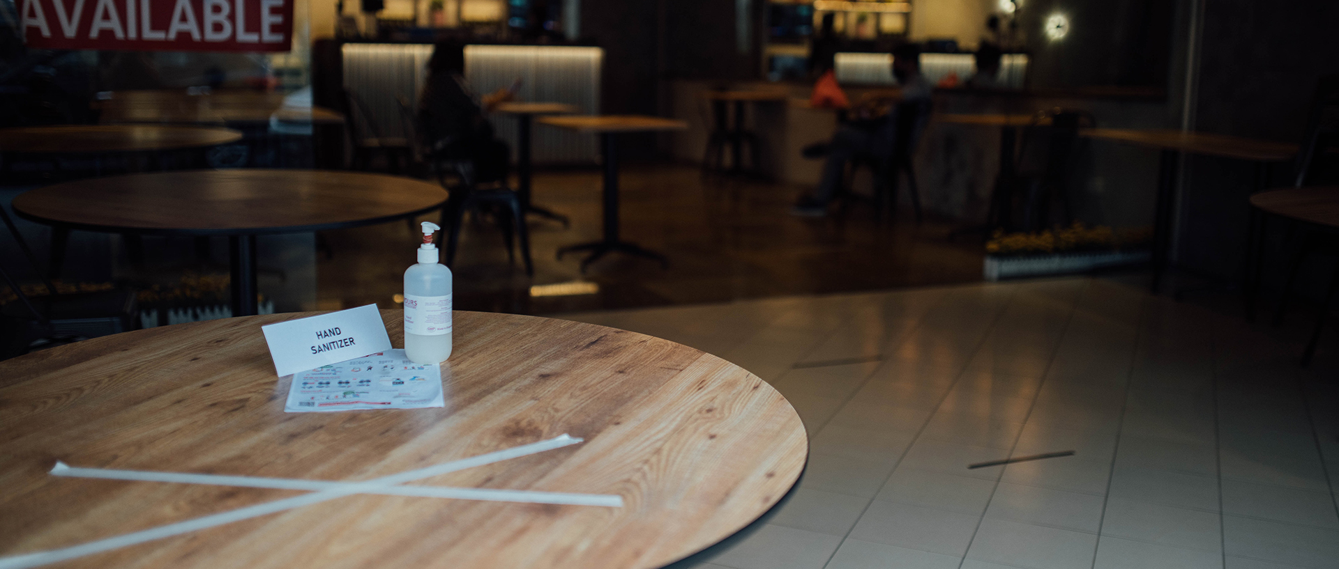 A sanitation station set-up at the enterance inside a restaurant